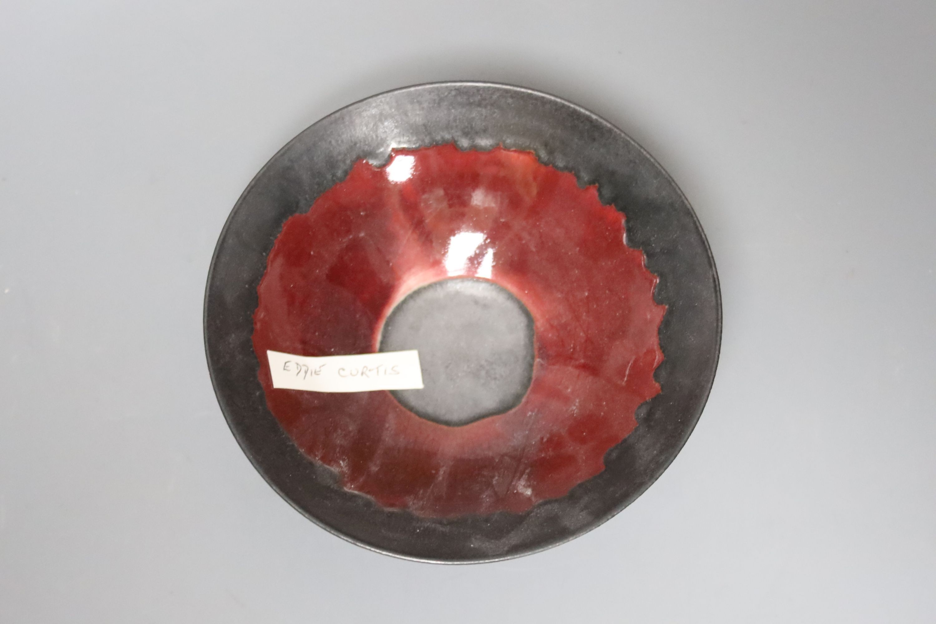 Eddie Curtis (b.1953), a copper red bowl, 16cm
